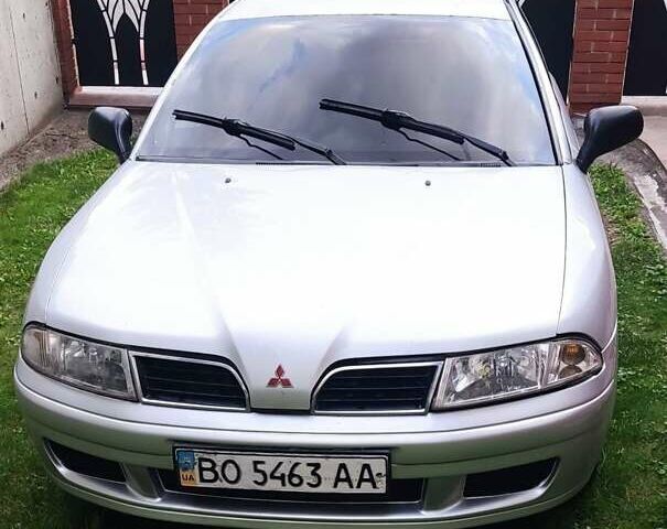 Белый Мицубиси Харизма, объемом двигателя 1.9 л и пробегом 183 тыс. км за 2650 $, фото 1 на Automoto.ua