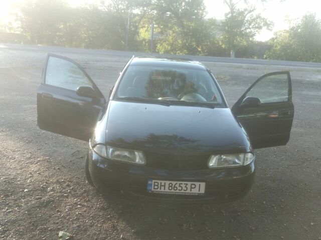 Черный Мицубиси Харизма, объемом двигателя 1.6 л и пробегом 1 тыс. км за 1700 $, фото 1 на Automoto.ua