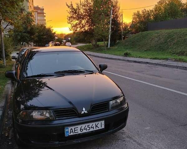 Чорний Міцубісі Харизма, об'ємом двигуна 1.6 л та пробігом 408 тис. км за 2600 $, фото 1 на Automoto.ua