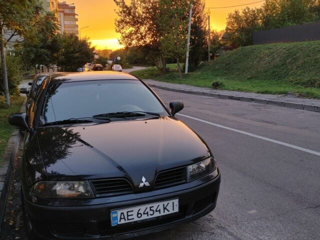 Чорний Міцубісі Харизма, об'ємом двигуна 1.6 л та пробігом 408 тис. км за 2600 $, фото 1 на Automoto.ua