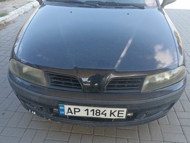 Черный Мицубиси Харизма, объемом двигателя 1.6 л и пробегом 402 тыс. км за 2200 $, фото 1 на Automoto.ua