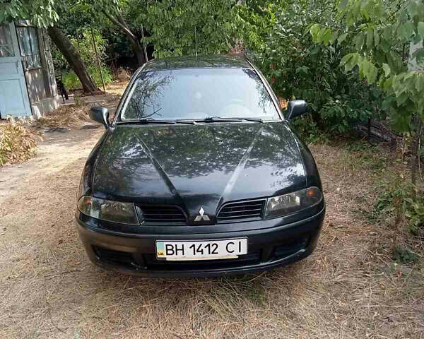 Черный Мицубиси Харизма, объемом двигателя 1.6 л и пробегом 167 тыс. км за 3100 $, фото 1 на Automoto.ua