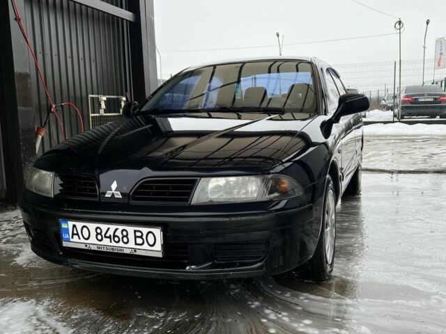 Чорний Міцубісі Харизма, об'ємом двигуна 1.6 л та пробігом 300 тис. км за 3100 $, фото 1 на Automoto.ua