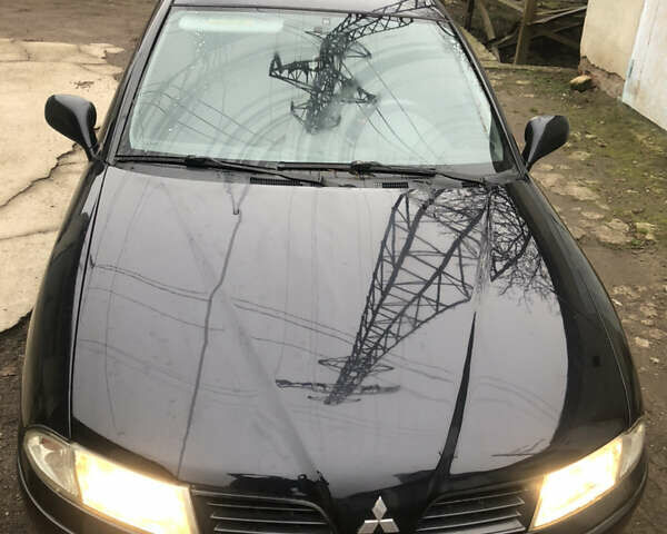 Чорний Міцубісі Харизма, об'ємом двигуна 1.6 л та пробігом 270 тис. км за 4300 $, фото 1 на Automoto.ua