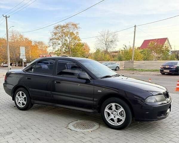 Фиолетовый Мицубиси Харизма, объемом двигателя 1.6 л и пробегом 236 тыс. км за 3000 $, фото 1 на Automoto.ua