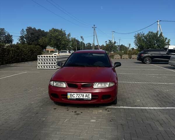 Красный Мицубиси Харизма, объемом двигателя 1.8 л и пробегом 350 тыс. км за 1900 $, фото 1 на Automoto.ua