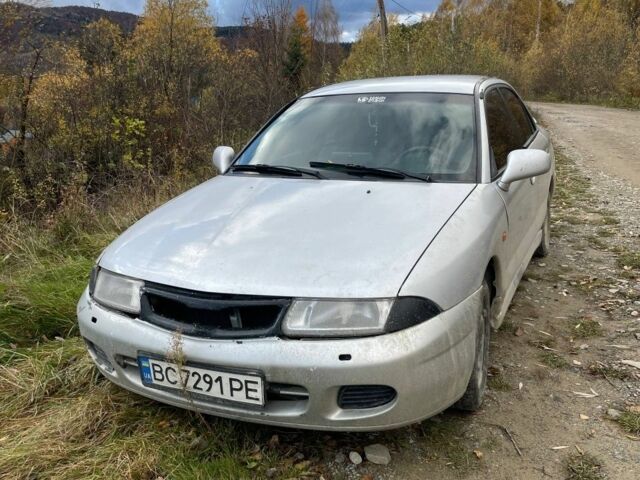 Серый Мицубиси Харизма, объемом двигателя 1.6 л и пробегом 270 тыс. км за 750 $, фото 1 на Automoto.ua