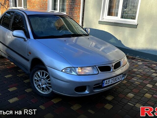 Сірий Міцубісі Харизма, об'ємом двигуна 1.8 л та пробігом 296 тис. км за 1600 $, фото 1 на Automoto.ua