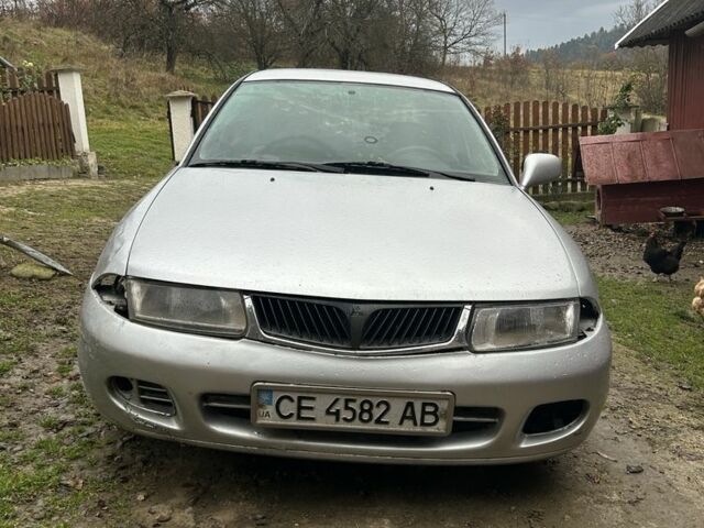 Сірий Міцубісі Харизма, об'ємом двигуна 1.9 л та пробігом 350 тис. км за 1000 $, фото 1 на Automoto.ua