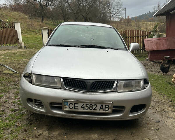 Сірий Міцубісі Харизма, об'ємом двигуна 1.9 л та пробігом 368 тис. км за 1000 $, фото 1 на Automoto.ua