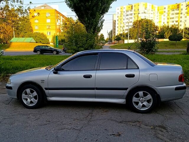 Сірий Міцубісі Харизма, об'ємом двигуна 1.8 л та пробігом 232 тис. км за 2800 $, фото 1 на Automoto.ua