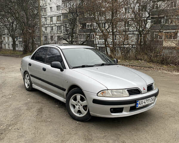 Сірий Міцубісі Харизма, об'ємом двигуна 1.83 л та пробігом 265 тис. км за 2850 $, фото 1 на Automoto.ua