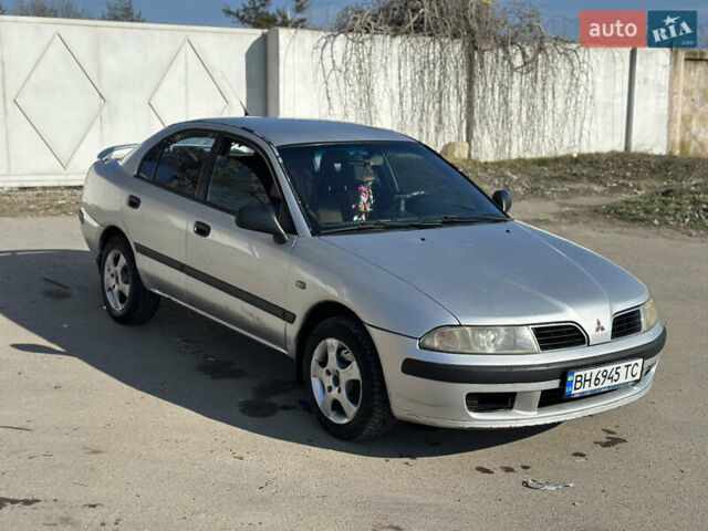 Сірий Міцубісі Харизма, об'ємом двигуна 1.6 л та пробігом 200 тис. км за 2600 $, фото 1 на Automoto.ua