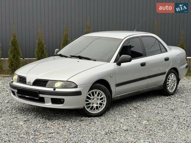 Серый Мицубиси Харизма, объемом двигателя 1.83 л и пробегом 326 тыс. км за 3400 $, фото 1 на Automoto.ua