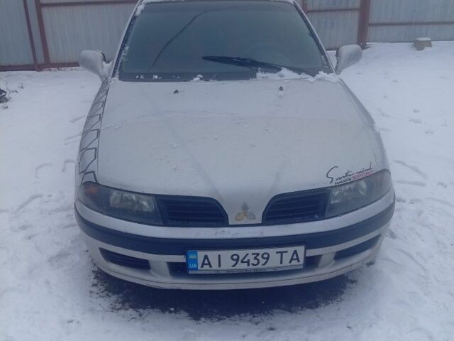 Серый Мицубиси Харизма, объемом двигателя 1.6 л и пробегом 217 тыс. км за 2700 $, фото 1 на Automoto.ua