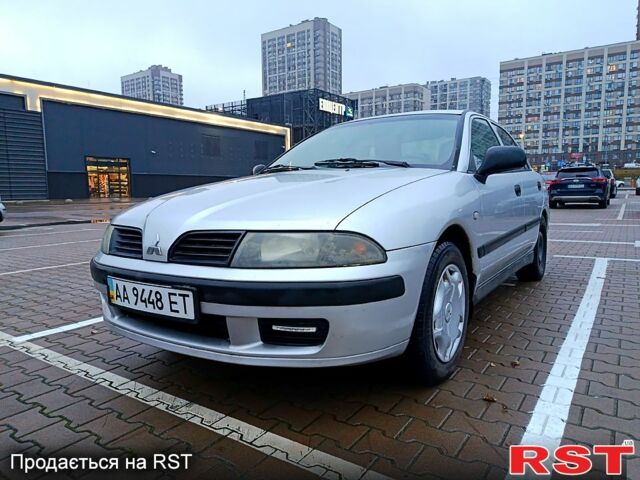 Серый Мицубиси Харизма, объемом двигателя 1.6 л и пробегом 212 тыс. км за 3700 $, фото 1 на Automoto.ua