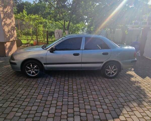 Серый Мицубиси Харизма, объемом двигателя 1.6 л и пробегом 286 тыс. км за 4800 $, фото 1 на Automoto.ua