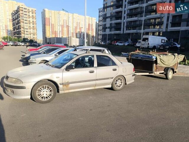 Серый Мицубиси Харизма, объемом двигателя 1.6 л и пробегом 270 тыс. км за 2300 $, фото 1 на Automoto.ua