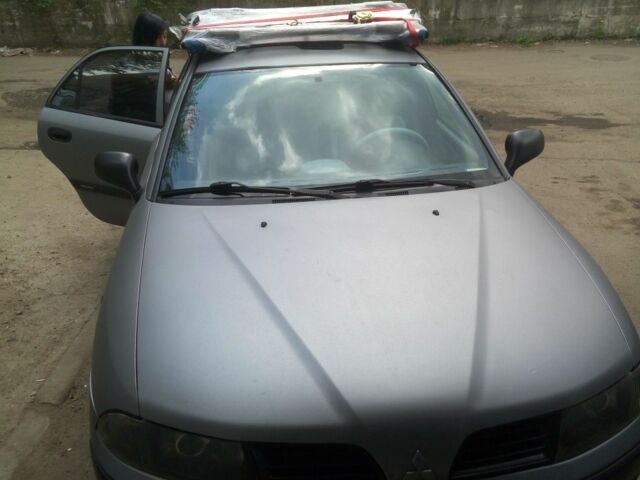 Серый Мицубиси Харизма, объемом двигателя 0 л и пробегом 360 тыс. км за 2000 $, фото 1 на Automoto.ua