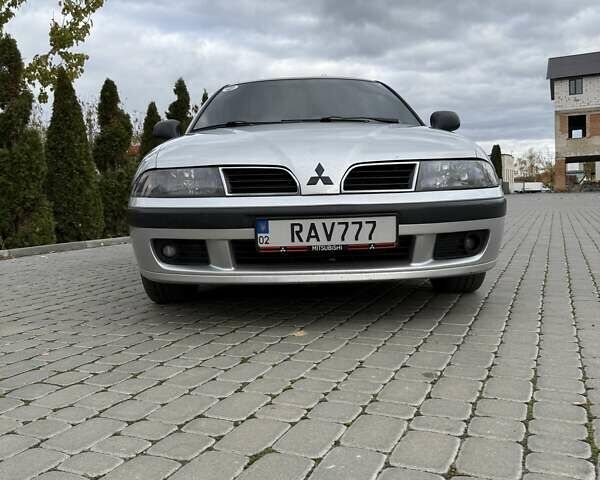 Сірий Міцубісі Харизма, об'ємом двигуна 1.83 л та пробігом 319 тис. км за 4500 $, фото 1 на Automoto.ua