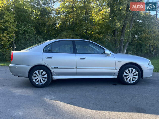 Серый Мицубиси Харизма, объемом двигателя 1.8 л и пробегом 214 тыс. км за 5650 $, фото 1 на Automoto.ua