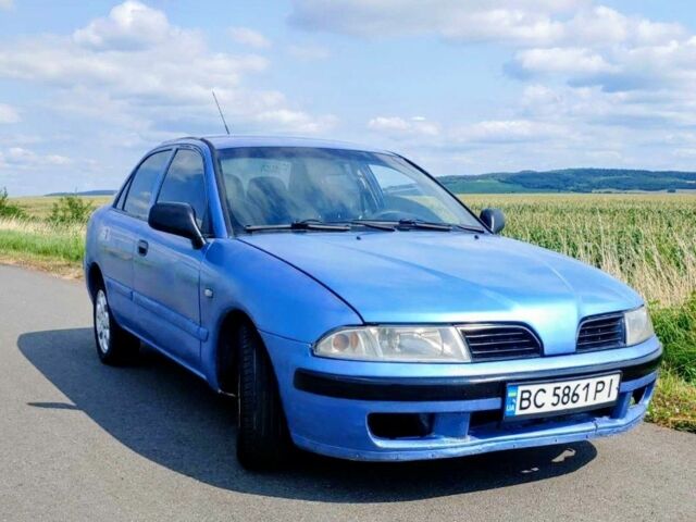 Синій Міцубісі Харизма, об'ємом двигуна 1.6 л та пробігом 300 тис. км за 1900 $, фото 1 на Automoto.ua