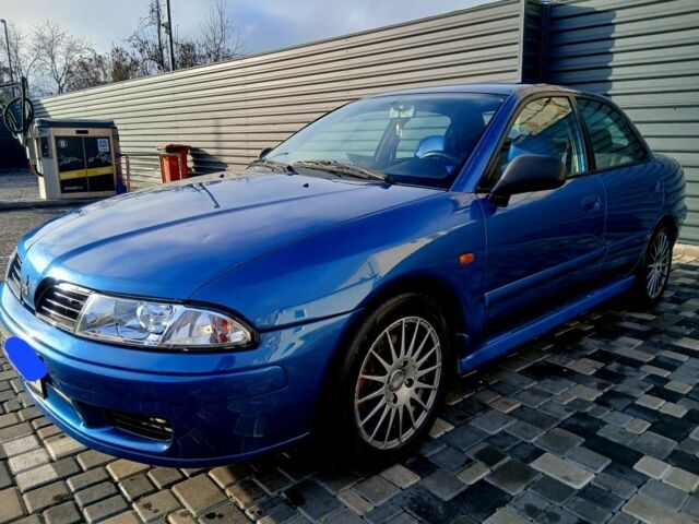 Синий Мицубиси Харизма, объемом двигателя 1.8 л и пробегом 305 тыс. км за 3999 $, фото 1 на Automoto.ua