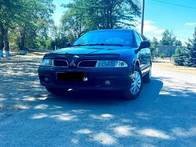 Синий Мицубиси Харизма, объемом двигателя 1.6 л и пробегом 384 тыс. км за 3250 $, фото 1 на Automoto.ua