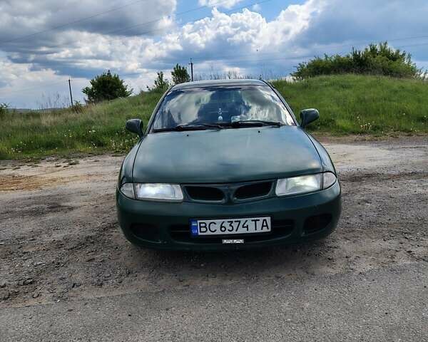 Зеленый Мицубиси Харизма, объемом двигателя 1.6 л и пробегом 399 тыс. км за 2300 $, фото 1 на Automoto.ua