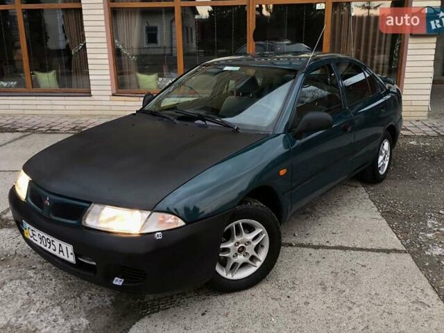 Зеленый Мицубиси Харизма, объемом двигателя 1.6 л и пробегом 357 тыс. км за 1480 $, фото 1 на Automoto.ua