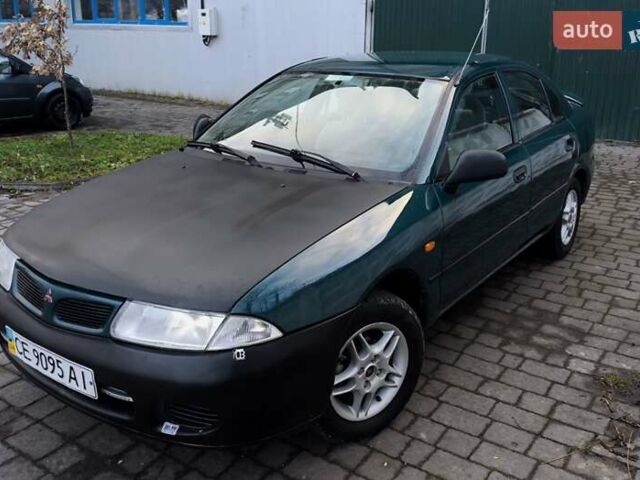 Зелений Міцубісі Харизма, об'ємом двигуна 1.6 л та пробігом 357 тис. км за 1399 $, фото 1 на Automoto.ua