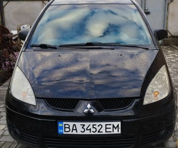 Черный Мицубиси Кольт, объемом двигателя 1.3 л и пробегом 215 тыс. км за 4300 $, фото 1 на Automoto.ua