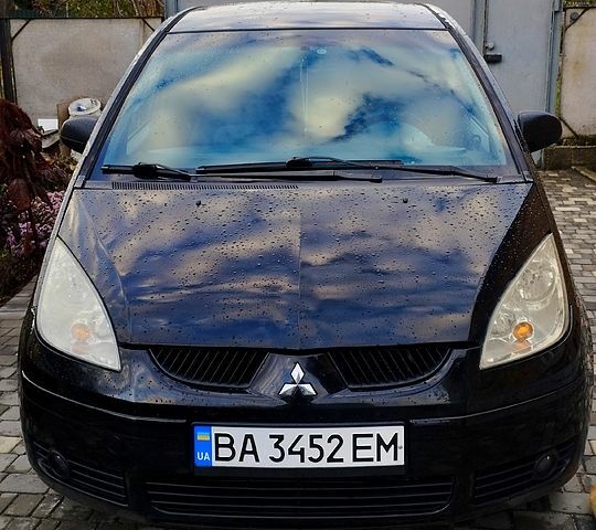 Черный Мицубиси Кольт, объемом двигателя 1.3 л и пробегом 215 тыс. км за 3800 $, фото 1 на Automoto.ua