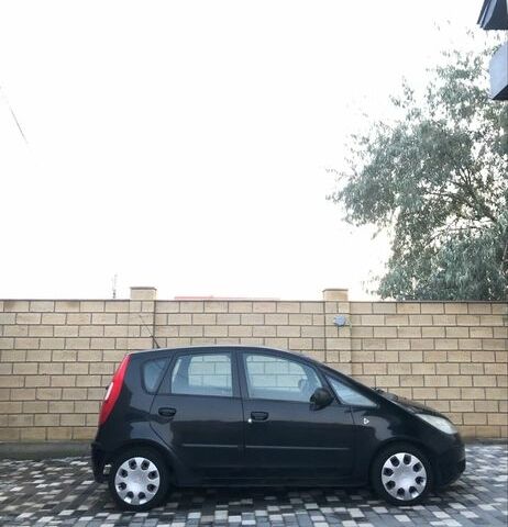 Черный Мицубиси Кольт, объемом двигателя 1.3 л и пробегом 234 тыс. км за 3999 $, фото 1 на Automoto.ua