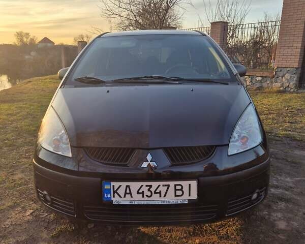Чорний Міцубісі Кольт, об'ємом двигуна 1.33 л та пробігом 184 тис. км за 5000 $, фото 1 на Automoto.ua