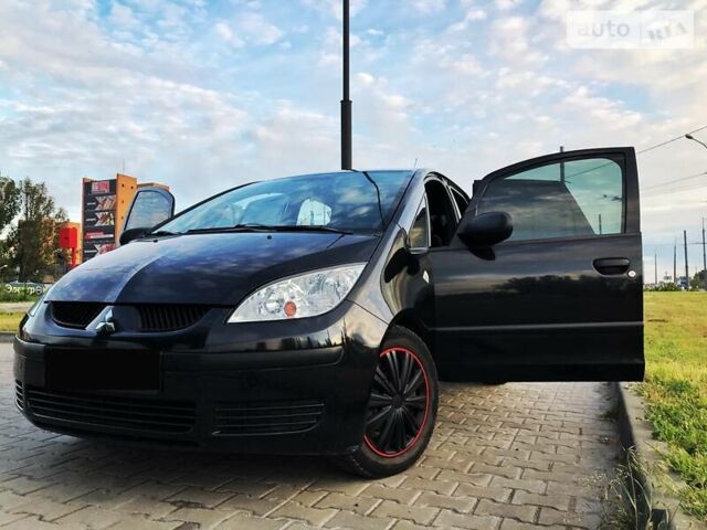 Черный Мицубиси Кольт, объемом двигателя 1.3 л и пробегом 150 тыс. км за 5601 $, фото 1 на Automoto.ua