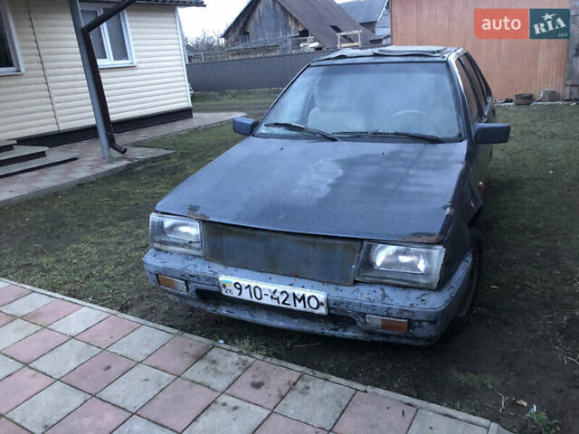 Серый Мицубиси Кольт, объемом двигателя 1.5 л и пробегом 290 тыс. км за 399 $, фото 1 на Automoto.ua