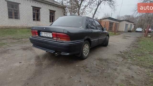 Черный Мицубиси Галант, объемом двигателя 1.8 л и пробегом 441 тыс. км за 1600 $, фото 1 на Automoto.ua