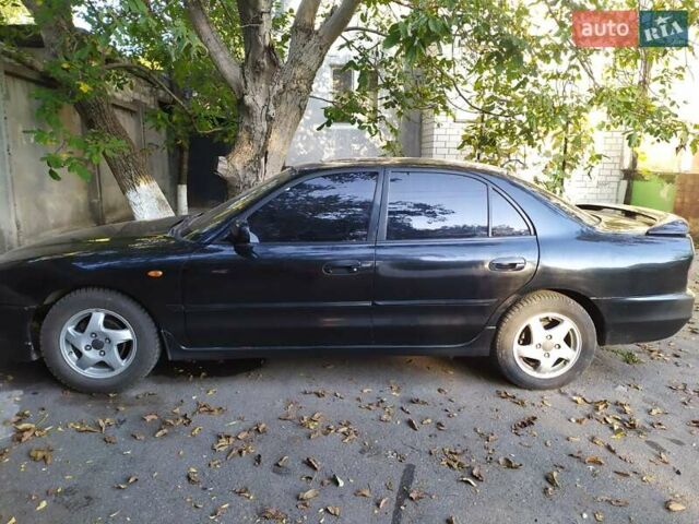 Черный Мицубиси Галант, объемом двигателя 2 л и пробегом 160 тыс. км за 3000 $, фото 1 на Automoto.ua
