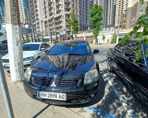 Черный Мицубиси Галант, объемом двигателя 2.4 л и пробегом 165 тыс. км за 5500 $, фото 1 на Automoto.ua