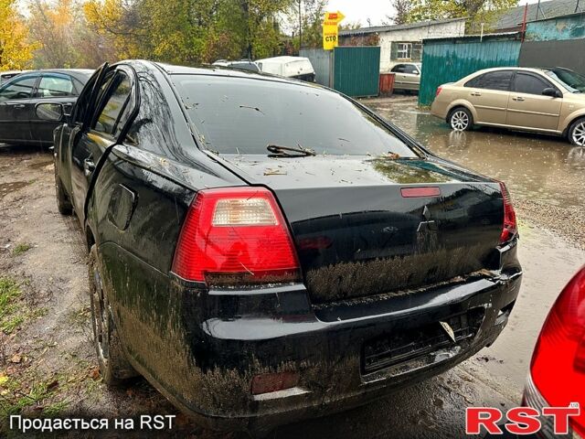 Черный Мицубиси Галант, объемом двигателя 2.4 л и пробегом 200 тыс. км за 1300 $, фото 1 на Automoto.ua