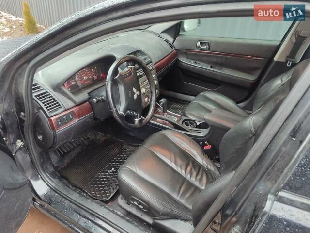 Черный Мицубиси Галант, объемом двигателя 2.4 л и пробегом 184 тыс. км за 5500 $, фото 1 на Automoto.ua