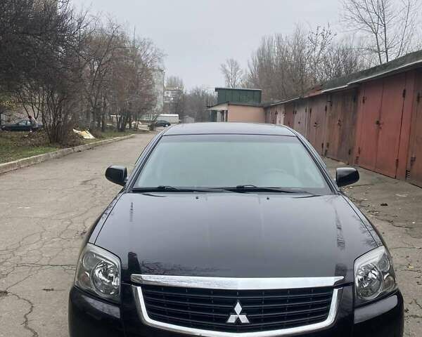 Черный Мицубиси Галант, объемом двигателя 2.38 л и пробегом 168 тыс. км за 6500 $, фото 1 на Automoto.ua