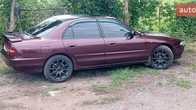 Красный Мицубиси Галант, объемом двигателя 2 л и пробегом 275 тыс. км за 2200 $, фото 1 на Automoto.ua