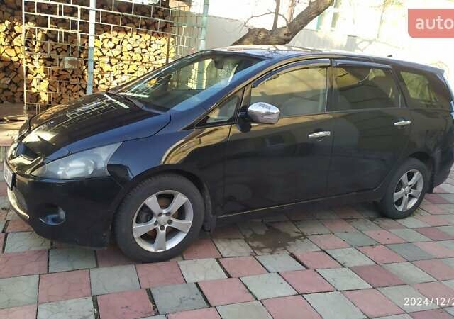 Черный Мицубиси Грандис, объемом двигателя 2.4 л и пробегом 282 тыс. км за 5400 $, фото 1 на Automoto.ua