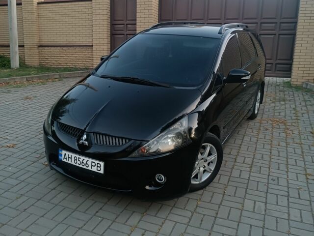 Черный Мицубиси Грандис, объемом двигателя 2.4 л и пробегом 270 тыс. км за 6000 $, фото 1 на Automoto.ua