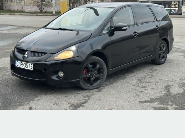 Черный Мицубиси Грандис, объемом двигателя 2 л и пробегом 290 тыс. км за 2600 $, фото 1 на Automoto.ua