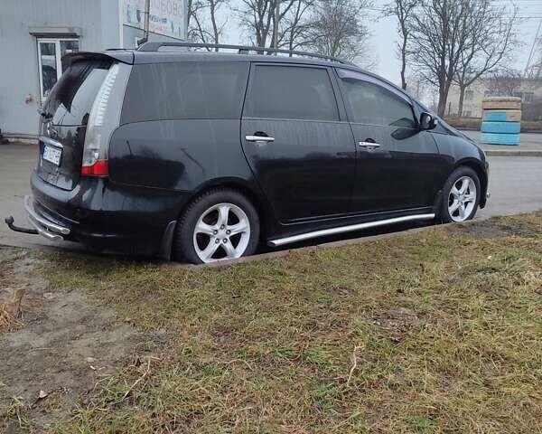 Черный Мицубиси Грандис, объемом двигателя 2.4 л и пробегом 260 тыс. км за 5990 $, фото 1 на Automoto.ua