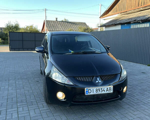 Черный Мицубиси Грандис, объемом двигателя 2.4 л и пробегом 290 тыс. км за 4600 $, фото 1 на Automoto.ua