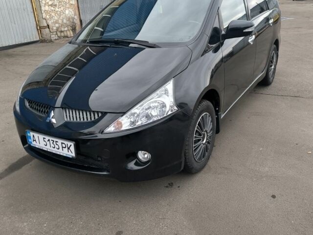 Черный Мицубиси Грандис, объемом двигателя 2.4 л и пробегом 62 тыс. км за 8500 $, фото 1 на Automoto.ua